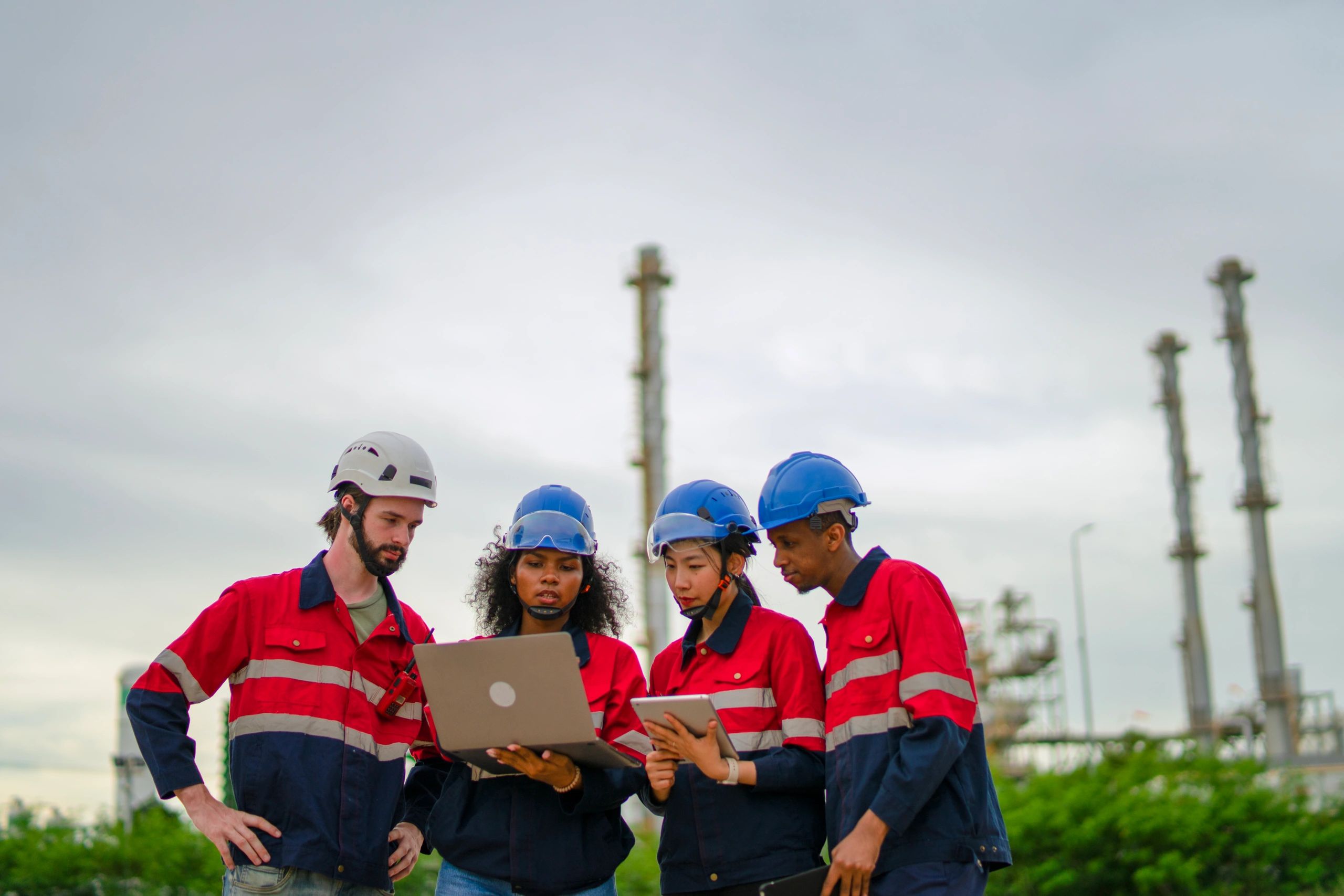 Industrial workers collaborating at an active site
